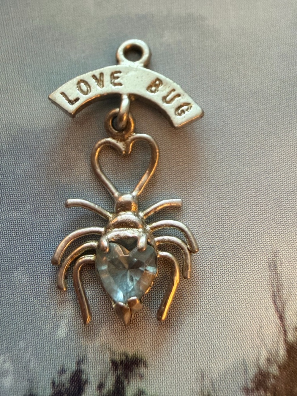 Silver 'Love Bug' Heart Spider Pendant with Light Blue Gem